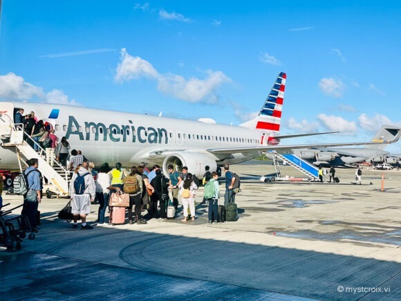 people boarding american airlines via stairs